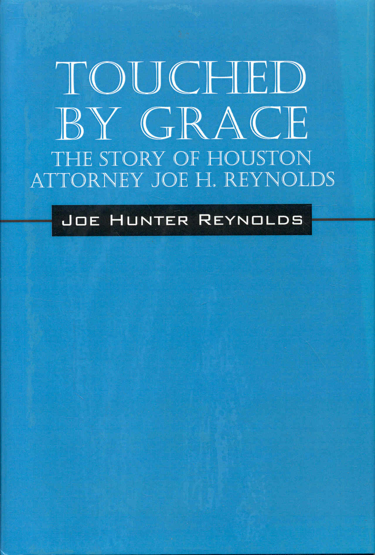 Touched by Grace: The Story of Houston Attorney Joe H. Reynolds