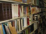color photograph of books on metal library shelving